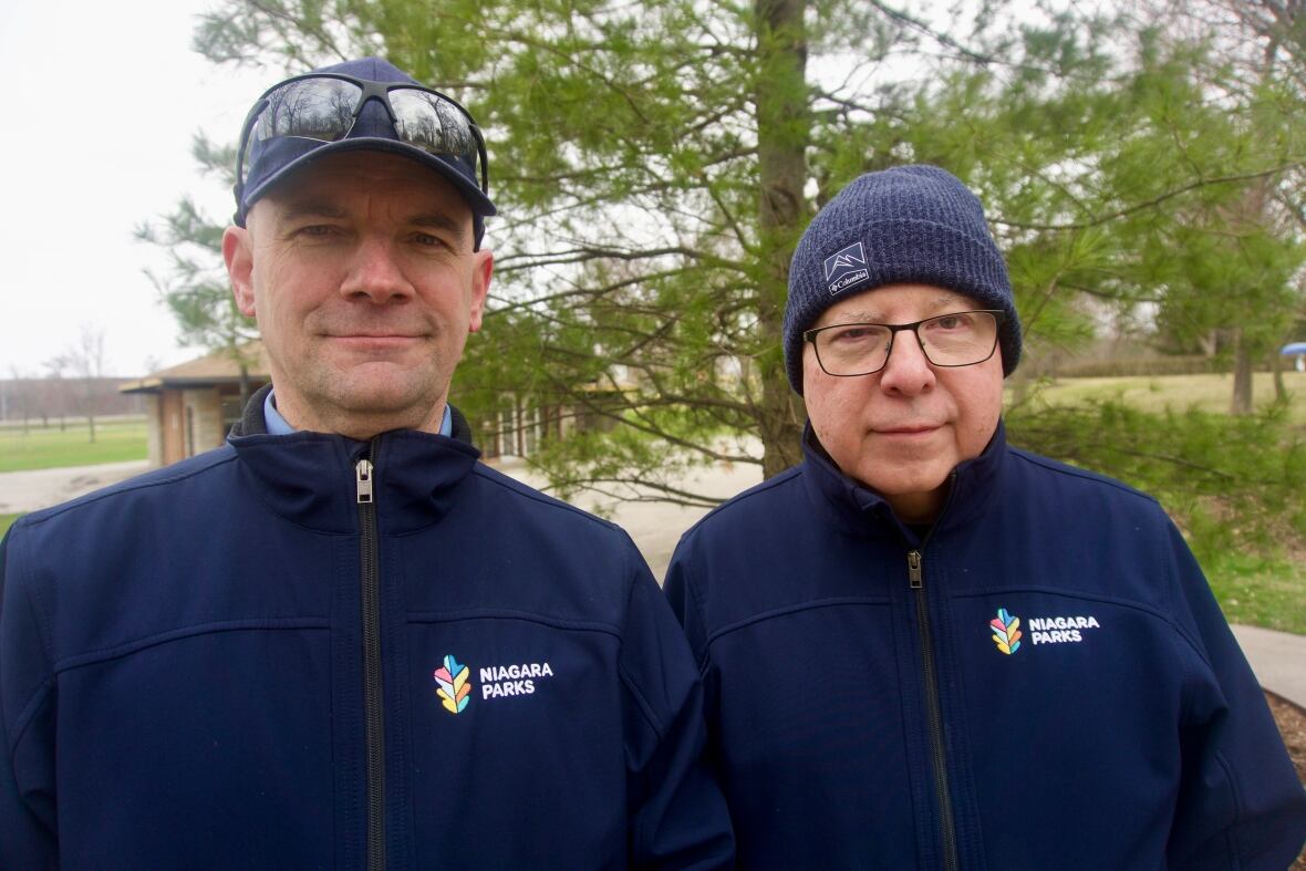 Two men standing outside 